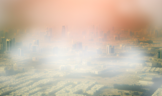 Hazy atmosphere around a highly urbanized city representing increased greenhouse gas emissions